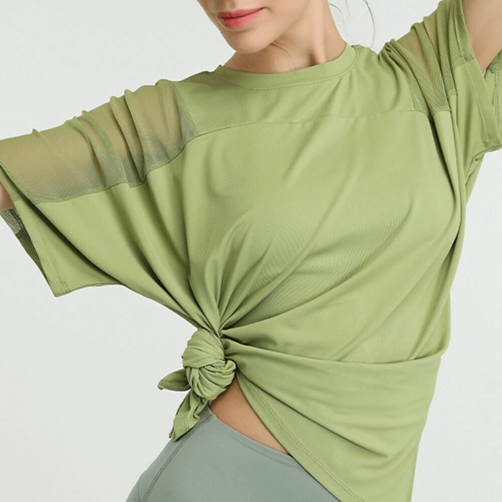 Women's loose running mesh short sleeve t-shirt in green, ideal for workouts, featuring breathable fabric with quick-dry technology.